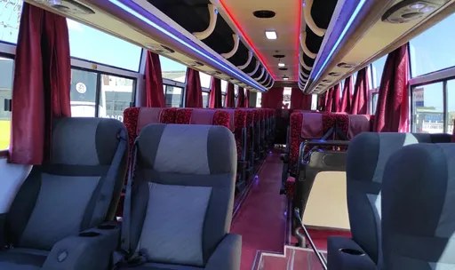 Rayan Coach VIP interior with reclining seats and curtains